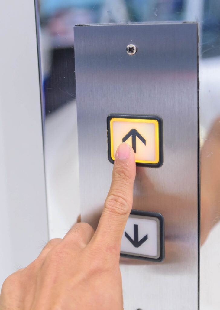 The man push lift button up Elevator button - POTs replacement