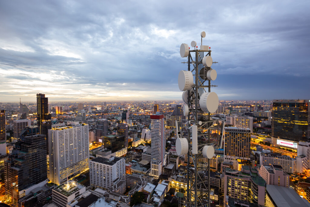 Telecommunication tower with 5G cellular network antenna on nigh